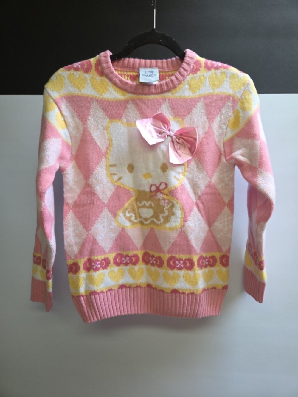 Sanrio Hello Kitty Holiday Sweater Pink Yellow Ribbon Small NWOT